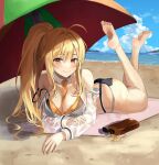  1girl ahoge ass bare_arms bare_legs bare_shoulders barefoot beach beach_mat beach_umbrella between_breasts bikini black_bikini blonde_hair breasts cleavage closed_mouth day detached_collar fakey feet large_breasts legs_up long_hair long_sleeves looking_at_viewer lotion_bottle lying multi-strapped_bikini necktie ocean off_shoulder on_stomach original outdoors ponytail see-through see-through_sleeves sidelocks smile solo strap_slip string_bikini swimsuit the_pose thighs umbrella very_long_hair wrist_cuffs yellow_eyes 
