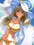  1girl absurdres bangs bikini blue_archive blue_sky brown_hair closed_mouth cloud collarbone commentary_request day green_eyes halo hand_on_headwear hat highres kabu_(niniko2ko) long_hair looking_at_viewer navel nonomi_(blue_archive) nonomi_(swimsuit)_(blue_archive) side-tie_bikini sky smile solo swimsuit white_headwear yellow_bikini 