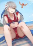  1girl ;d akacolor bangs bare_shoulders beach bikini bikini_skirt bird blue_scarf blue_sky breasts cleavage closed_eyes collarbone fire_emblem fire_emblem:_radiant_dawn fire_emblem_heroes flower grey_hair hair_flower hair_ornament hair_ribbon half_updo highres long_hair looking_to_the_side medium_breasts micaiah_(fire_emblem) miniskirt navel ocean one_eye_closed open_mouth red_bikini red_swimsuit ribbon scarf sitting skirt sky smile solo swimsuit towel water wet yellow_eyes yune_(fire_emblem) 