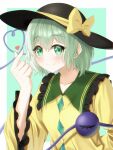  1girl black_hat blush border bow buttons closed_mouth collarbone commentary_request diamond_button finger_heart frilled_shirt_collar frilled_sleeves frills green_background green_eyes green_hair hair_between_eyes hand_up happy hat hat_bow heart heart_of_string highres koishi_day komeiji_koishi long_sleeves looking_at_viewer retora_26 shirt short_hair simple_background smile solo touhou upper_body white_border wide_sleeves yellow_bow yellow_shirt 