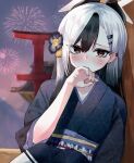  1girl black_hair black_kimono blue_archive blush e.nick ear_piercing eyes_visible_through_hair fingernails firework_background fireworks flower hair_flower hair_ornament halo hand_to_own_mouth highres horns japanese_clothes kayoko_(blue_archive) kayoko_(new_year)_(blue_archive) kimono leaning_on_object multicolored_hair obi piercing red_eyes sash solo torii two-tone_hair white_hair wooden_wall 