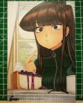  1girl :&lt; black_eyes brown_hair cake cheesecake cup cutting_mat food green_sweater highres indoors komi-san_wa_komyushou_desu komi_shouko looking_at_viewer marker_(medium) mug omar_dogan photo_(medium) plate pointing pointing_at_self sanpaku signature solo sweater traditional_media turtleneck turtleneck_sweater whipped_cream wide-eyed window 