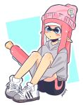 1girl :o artist_name beanie bike_shorts blue_background blue_eyes commentary cross-laced_footwear daturawr grey_sweater gun hat highres holding holding_gun holding_weapon inkling inkling_girl inkling_player_character long_hair pink_hair pink_headwear pointy_ears shoes sitting solo splatoon_(series) splatoon_3 splattershot_(splatoon) sweater tentacle_hair twitter_username two-tone_background weapon white_background white_footwear 