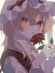  1girl bangs blonde_hair commentary flandre_scarlet flower hair_between_eyes hat hat_ribbon highres hisu_(hisu_) holding holding_flower long_hair long_sleeves looking_at_viewer mob_cap open_mouth red_eyes red_flower red_ribbon red_rose red_vest ribbon rose shirt solo touhou upper_body vest white_background white_headwear white_shirt 