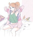  1girl armpits atsumi_yoshioka closed_mouth green_eyes green_shirt hair_ornament heart heart_hair_ornament long_hair on_bed orange_hair pillow pink_shorts pokemon pokemon:_twilight_wings pokemon_(creature) shirt shorts side_ponytail sitting sleeveless sleeveless_shirt smile sonia_(pokemon) yamper 