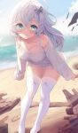  1girl beach blue_eyes blush bow breasts cleavage collarbone commentary_request covered_nipples hair_bow highres komone_ushio leaning_forward long_hair long_sleeves looking_at_viewer medium_breasts ocean off-shoulder_shirt off_shoulder original parted_lips shirt solo thighhighs thighs wavy_hair white_hair white_thighhighs wind 