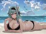  1girl ass bangs bare_arms bare_legs bare_shoulders beach bikini black_bikini black_hairband blue_hair blue_sky blush breasts brown_eyes cleavage cloud commentary_request day eula_(genshin_impact) feet_out_of_frame genshin_impact hair_ornament hairband hand_up head_tilt highres large_breasts looking_at_viewer lying ocean on_stomach partial_commentary short_hair sky solo swimsuit the_olphy thighs water 