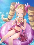  1girl beatrice_(re:zero) blonde_hair blue_eyes cup drill_hair drinking_straw feet_out_of_frame hair_ornament highres innertube looking_at_viewer navel re:zero_kara_hajimeru_isekai_seikatsu s_(hdru2332) sidelocks solo swimsuit symbol-shaped_pupils twin_drills water 