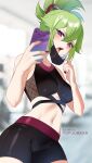  1girl adapted_costume bare_shoulders bike_shorts black_nails blurry blurry_background breasts cellphone crop_top genshin_impact green_hair highres holding holding_phone kuki_shinobu mask mask_pull medium_breasts midriff mouth_mask nail_polish navel open_mouth patreon_username phone pulled_by_self purple_eyes selfie short_ponytail smartphone solo sports_bra stomach tofuubear 