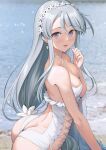  1girl absurdres ass bare_arms bare_shoulders beach blurry blurry_background blush breasts collarbone flower grey_hair hair_between_eyes hair_flower hair_ornament highres ichikawa_feesu kantai_collection long_hair looking_at_viewer median_furrow medium_hair ocean official_alternate_costume open_mouth purple_eyes sagiri_(kancolle) solo swimsuit upper_body white_flower white_hair white_swimsuit 