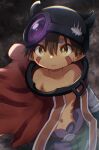  1boy bright_pupils brown_eyes brown_hair cape clant_st dark_skin facial_mark fake_horns hair_between_eyes helmet highres horned_helmet horns made_in_abyss male_focus mechanical_arms navel no_shirt pointy_ears red_cape regu_(made_in_abyss) solo standing white_pupils 