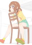  1girl :3 absurdres blue_shorts blush braid brown_hair chair closed_mouth delicious_party_precure hair_rings hanamichi_ran highres looking_away on_chair precure puffy_short_sleeves puffy_sleeves red_eyes red_footwear shirt shoe_soles shoes short_shorts short_sleeves shorts sincos sitting sitting_backwards solo yellow_shirt 