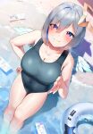  1girl amane_kanata angel angel_wings beach black_swimsuit blue_hair breasts cleavage colored_inner_hair covered_navel eyes_visible_through_hair frikulu grey_hair halo hand_on_hip hand_up highres hololive innertube large_breasts looking_at_viewer multicolored_hair one-piece_swimsuit outdoors purple_eyes sand short_hair solo standing star_halo swimsuit virtual_youtuber wading water white_wings wings 