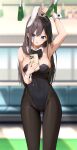  1girl :o absurdres animal_ears arm_up armpits black_bow black_hair black_leotard black_pantyhose blue_eyes blush bow breasts cellphone covered_navel dduck_kong detached_collar fake_animal_ears groin hair_over_shoulder hand_grip highres holding holding_phone iphone iphone_11_pro large_breasts leotard long_hair looking_at_phone original pantyhose phone playboy_bunny rabbit_ears seat smartphone solo train_interior very_long_hair wrist_cuffs 