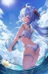  1girl absurdres ahoge ass ball bangs beachball bikini blue_hair blue_sky breasts cloud commentary crossed_bangs day english_commentary flower frilled_bikini frills from_behind ganyu_(genshin_impact) genshin_impact goat_horns hair_between_eyes highres holding holding_ball horns long_hair looking_at_viewer ocean outdoors palm_tree partially_submerged pengrani purple_eyes sky summer sun swimsuit thigh_strap thighs tree white_bikini 