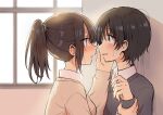  2girls backlighting betock black_hair black_sweater blurry blurry_background blush brown_eyes brown_hair eye_contact eyelashes green_scrunchie hand_on_another&#039;s_cheek hand_on_another&#039;s_face highres holding_another&#039;s_wrist long_sleeves looking_at_another multiple_girls original ponytail revision scrunchie short_hair sweatdrop sweater window yuri 