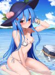  1girl bare_arms bare_legs bare_shoulders barefoot bikini black_headwear blue_hair blush breasts closed_mouth collarbone day food fruit hair_between_eyes hat highres hinanawi_tenshi jewelry long_hair necklace peach red_eyes rock small_breasts smile solo swimsuit touhou twitter_username water white_bikini yoshinatsu 