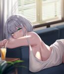  1girl bangs bare_shoulders blush breasts camisole couch cup green_eyes grey_hair highres hololive large_breasts looking_at_viewer lying moisture_(chichi) on_stomach shirogane_noel short_hair solo virtual_youtuber white_camisole 
