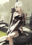  1girl android armlet asymmetrical_legwear black_gloves black_shorts black_tank_top blue_eyes building closed_mouth covered_nipples elbow_gloves error fadingz gloves grass hair_over_one_eye highres holding holding_sword holding_weapon joints mole mole_under_mouth nier_(series) nier_automata revision robot_joints rock short_hair shorts sitting solo sword tank_top weapon white_background white_hair yellow_background yorha_type_a_no._2 