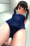 1girl absurdres arms_behind_back bangs black_hair blue_one-piece_swimsuit blurry blurry_background blush breasts brown_eyes casual_one-piece_swimsuit ceiling closed_mouth cowboy_shot depth_of_field dutch_angle embarrassed fingernails from_below full-face_blush hair_over_shoulder hand_on_table highres light looking_at_viewer looking_down matsunaga_kouyou medium_hair one-piece_swimsuit original short_twintails sidelocks small_breasts solo standing swept_bangs swimsuit thighs twintails 