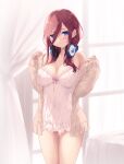  1girl absurdres bangs blue_eyes breasts brown_hair cait_aron commentary go-toubun_no_hanayome hair_between_eyes headphones headphones_around_neck highres indoors large_breasts long_hair long_sleeves looking_at_viewer nakano_miku no_pants off_shoulder parted_lips sleeves_past_wrists solo sweater thigh_gap window 