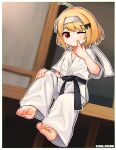  1girl ahoge artist_name barefoot belt black_belt black_bow blonde_hair bow chinese_commentary closed_mouth commentary_request dougi feet finger_to_mouth hair_bow highres kuma-bound martial_arts_belt medium_hair one_eye_closed original pants red_eyes sitting smile soles solo toes white_pants 