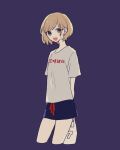  1girl arms_behind_back blonde_hair blue_eyes blush_stickers clothes_writing cropped_legs highres holding looking_at_viewer maco22 open_mouth original print_shirt purple_background shirt short_hair short_sleeves shorts smile solo t-shirt translation_request 