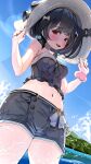  1girl bare_arms bare_shoulders black_hair blush breasts commentary_request curvy denim denim_shorts embarrassed granblue_fantasy hand_on_headwear hat highres kajimakoto looking_at_viewer medium_hair midriff narrow_waist navel ocean paid_reward_available red_eyes scrunchie short_sleeves shorts solo stomach strapless sun_hat swimsuit tube_top vikala_(granblue_fantasy) w_arms wide_hips wrist_scrunchie 