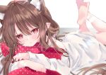  1girl absurdres animal_ear_fluff animal_ears barefoot blurry blurry_background blush brown_hair character_request commentary_request copyright_request extra_ears eyelashes feet_up hair_between_eyes highres looking_at_viewer lying moizumi_shipon object_hug on_stomach parted_lips pillow pointy_ears red_eyes shirt sidelocks soles solo toes white_shirt 