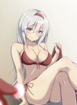  1girl alternate_costume bare_shoulders bespectacled bikini breasts cleavage collarbone commentary crossed_legs feet_out_of_frame glasses grey_hair hairband highres honma_(honmatomohiro) kantai_collection large_breasts long_hair looking_at_viewer red_bikini red_hairband rimless_eyewear shoukaku_(kancolle) sitting smile solo swimsuit 