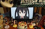  2d_dating birthday black_hair cake figure food guitar highres instrument k-on! lonely long_hair monitor nakano_azusa nendoroid photo school_uniform towel twintails 