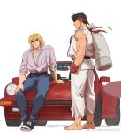  2boys bara barefoot black_hair blonde_hair carrying_over_shoulder contemporary denim dougi eye_contact full_body jeans ken_masters leather_belt looking_at_another male_focus multiple_boys muscular muscular_male pants purple_shirt ryu_(street_fighter) shirt shoes short_hair sideburns sitting_on_car smile sneakers street_fighter thick_eyebrows thighs tight tight_pants yuiofire 