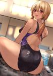  1girl blonde_hair blurry blurry_background competition_swimsuit from_behind highres indoors kihou_no_gotoku_dmc long_hair looking_at_viewer looking_back low_twintails one-piece_swimsuit open_mouth original pool red_eyes sitting smile solo swimsuit twintails water 