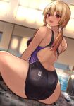  1girl :d ass blonde_hair blurry blurry_background competition_swimsuit from_behind highres huge_ass indoors kihou_no_gotoku_dmc long_hair looking_at_viewer looking_back low_twintails one-piece_swimsuit open_mouth original pool red_eyes sitting smile solo swimsuit twintails water 
