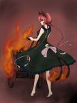  1girl animal_ears barefoot braid cat_ears dress fire flame flame-tipped_tail forked_tail full_body green_dress kaenbyou_rin nekomata profile red_eyes red_hair saigou_tsun sideways_glance simple_background smile solo standing tail torch touhou wheelbarrow 