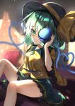  1girl absurdres bangs black_headwear blurry blurry_background closed_mouth dfra green_eyes green_hair green_skirt hat hat_ribbon heart heart-shaped_pupils heart_of_string highres indoors komeiji_koishi light_particles looking_at_viewer ribbon shirt skirt solo symbol-shaped_pupils third_eye touhou yellow_ribbon yellow_shirt 