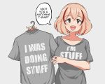  1girl :d alternate_costume azur_lane blonde_hair breasts brown_eyes clothes_writing english_text grey_background grey_shirt holding holding_clothes holding_shirt i&#039;m_stuff_(meme) large_breasts looking_at_viewer matching_outfit meme multicolored_hair parallelrey roon_(azur_lane) shirt simple_background smile solo speech_bubble streaked_hair t-shirt upper_body 