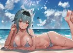  1girl :o bangs barefoot beach black_hairband blue_hair blush breasts cleavage cloud collarbone eula_(genshin_impact) feet genshin_impact hair_between_eyes hair_ornament hairband highres large_breasts legs legs_up long_hair looking_at_viewer lying ocean on_side outdoors sky soles solo sweat swimsuit the_olphy thighs toes wet yellow_eyes 