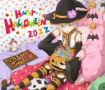  1girl bat_(animal) bed blush candy cosplay detached_sleeves eiyuu_densetsu fie_claussell food green_eyes hat highres jack-o&#039;-lantern lollipop sen_no_kiseki short_hair sitting solo stuffed_animal stuffed_toy thighhighs white_hair witch witch_f witch_hat 