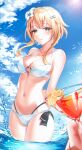  1girl absurdres arms_behind_back bikini blonde_hair blurry blurry_foreground blush breasts clear_sky cleavage cloud collarbone cowboy_shot cup day drink embarrassed flower genshin_impact green_eyes groin hair_flower hair_ornament highres holding holding_cup holding_drink implied_yuri large_breasts looking_at_viewer lumine_(genshin_impact) mella_(mell_a12) navel ocean partially_submerged short_hair short_hair_with_long_locks sky standing sunlight swimsuit water white_bikini white_flower yuri 