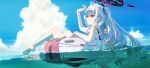  1girl afloat ahoge arm_up bangs barefoot blue_archive blurry closed_mouth cloud cumulonimbus_cloud day demon_horns depth_of_field full_body hair_ornament hairclip halo highres hina_(blue_archive) hina_(swimsuit)_(blue_archive) horns innertube long_hair looking_afar ocean omegu one_side_up outdoors parted_bangs partially_immersed purple_eyes sky solo sparkle summer swimsuit water white_hair 