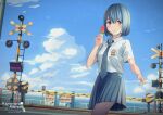  1girl absurdres bangs blue_hair blue_necktie blue_sky blush boom_barrier closed_mouth collared_shirt commentary commission day food grey_skirt highres holding holding_food indonesian_high_school_uniform looking_at_viewer necktie ocean original outdoors popsicle railing railroad_crossing red_eyes sayybils school_uniform shirt short_hair short_sleeves skirt sky smile solo summer vending_machine watermelon_bar white_shirt 