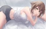  1girl bed_sheet black_shorts blue_eyes blush breasts brown_hair cleavage hair_between_eyes highres kantai_collection large_breasts lying monoku mutsu_(kancolle) navel on_side open_mouth short_hair shorts smile solo 