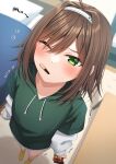  1girl ahoge arrow_(symbol) bangs blurry blurry_background blush brown_hair collarbone commentary_request depth_of_field drawstring flying_sweatdrops food food_in_mouth from_above green_eyes green_hoodie hair_between_eyes hair_intakes hairband haru_(kuzuyu) height highres holding hood hood_down hoodie indoors komori_kuzuyu layered_sleeves long_sleeves mouth_hold no_shoes original pocky puffy_long_sleeves puffy_sleeves shirt short_over_long_sleeves short_sleeves socks solo standing table trembling white_hairband white_shirt yellow_socks 