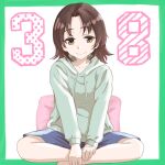  1girl absurdres bangs blue_shorts border brown_eyes brown_hair casual closed_mouth commentary drawstring girls_und_panzer green_border green_hoodie highres hood hood_down hoodie indian_style looking_at_viewer oritako parted_bangs pillow sawa_azusa short_hair shorts sitting smile solo 