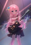  1girl black_skirt blue_eyes blush bocchi_the_rock! cube_hair_ornament electric_guitar feet_out_of_frame floating_hair gibson_les_paul gotou_hitori guitar hair_cubes hair_ornament holding holding_instrument holding_plectrum indoors instrument jacket light_particles long_hair music one_side_up pants pants_under_skirt pink_hair pink_jacket pink_pants pink_track_suit playing_instrument plectrum skirt solo stage_lights track_jacket yueying_su_meng_ling 