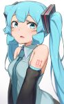  1girl abmayo bangs bare_shoulders breasts commentary detached_sleeves green_hair green_necktie hair_ornament hatsune_miku highres long_hair looking_at_viewer medium_breasts necktie open_mouth shirt shoulder_tattoo solo tattoo twintails upper_body very_long_hair vocaloid 