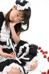  asian child cosplay japanese maid photo simple_background solo young younger 
