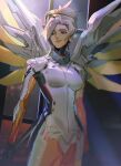  1girl animification bangs black_gloves blonde_hair blue_eyes bodysuit breasts cowboy_shot gloves hair_behind_ear highres looking_to_the_side looking_up mechanical_wings medium_breasts mercy_(overwatch) overwatch overwatch_2 parted_bangs ponytail smile solo thundergotch white_bodysuit wings 