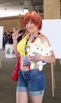  breasts cosplay green_eyes kasumi_(pokemon) large_breasts midriff peace_sign pokemon red_hair togepi v 